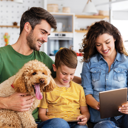 Family on Device with Dog